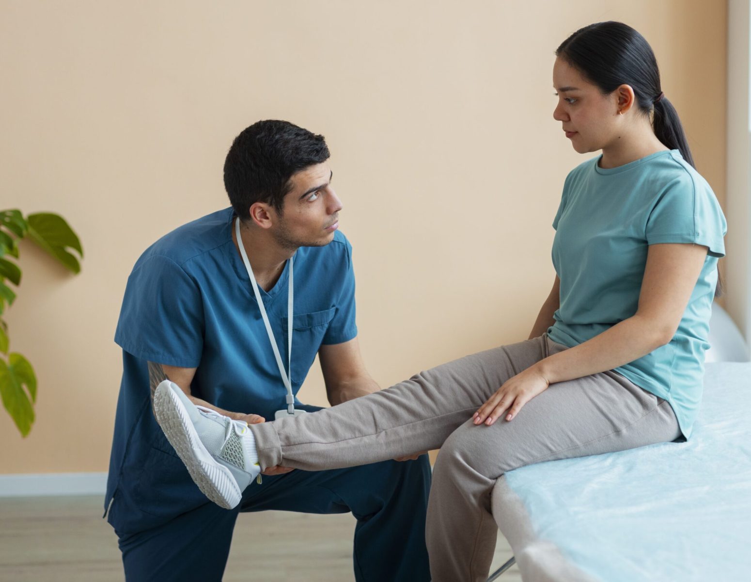 doctor-helping-patient-rehabilitation (2)-min